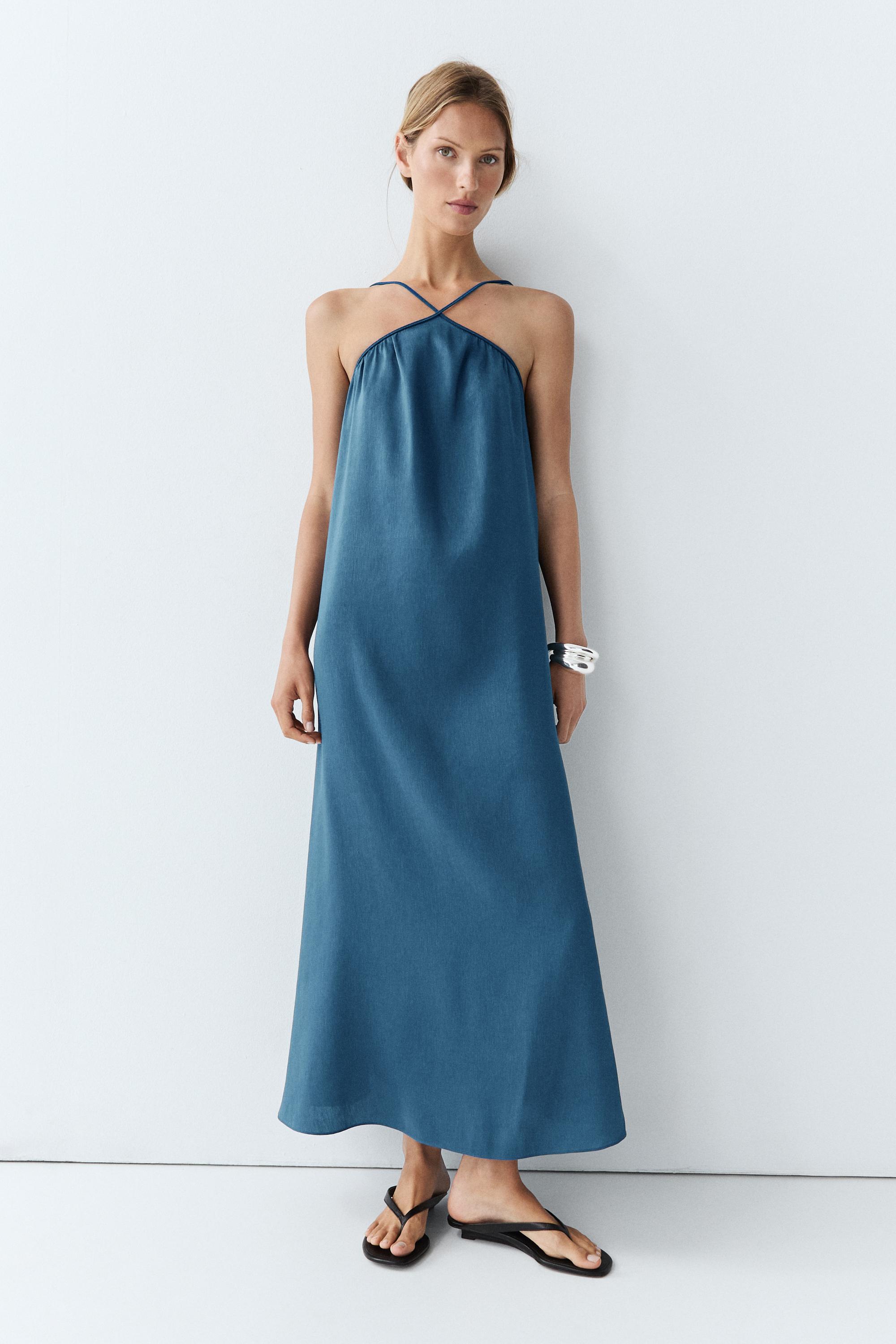 Long flowing dress with criss-cross straps
